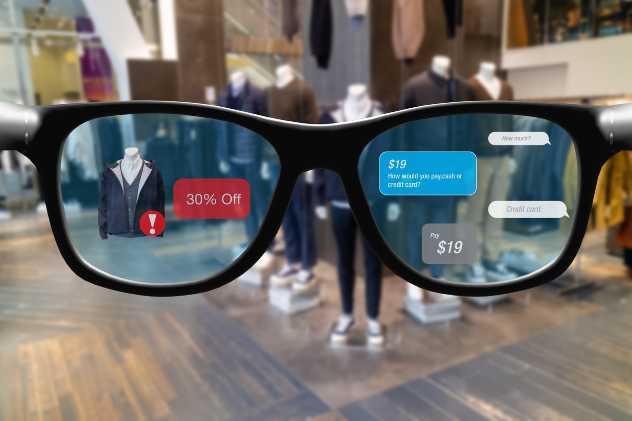 Smart glasses showing clothes and communication between to seller and buyer in a department store.