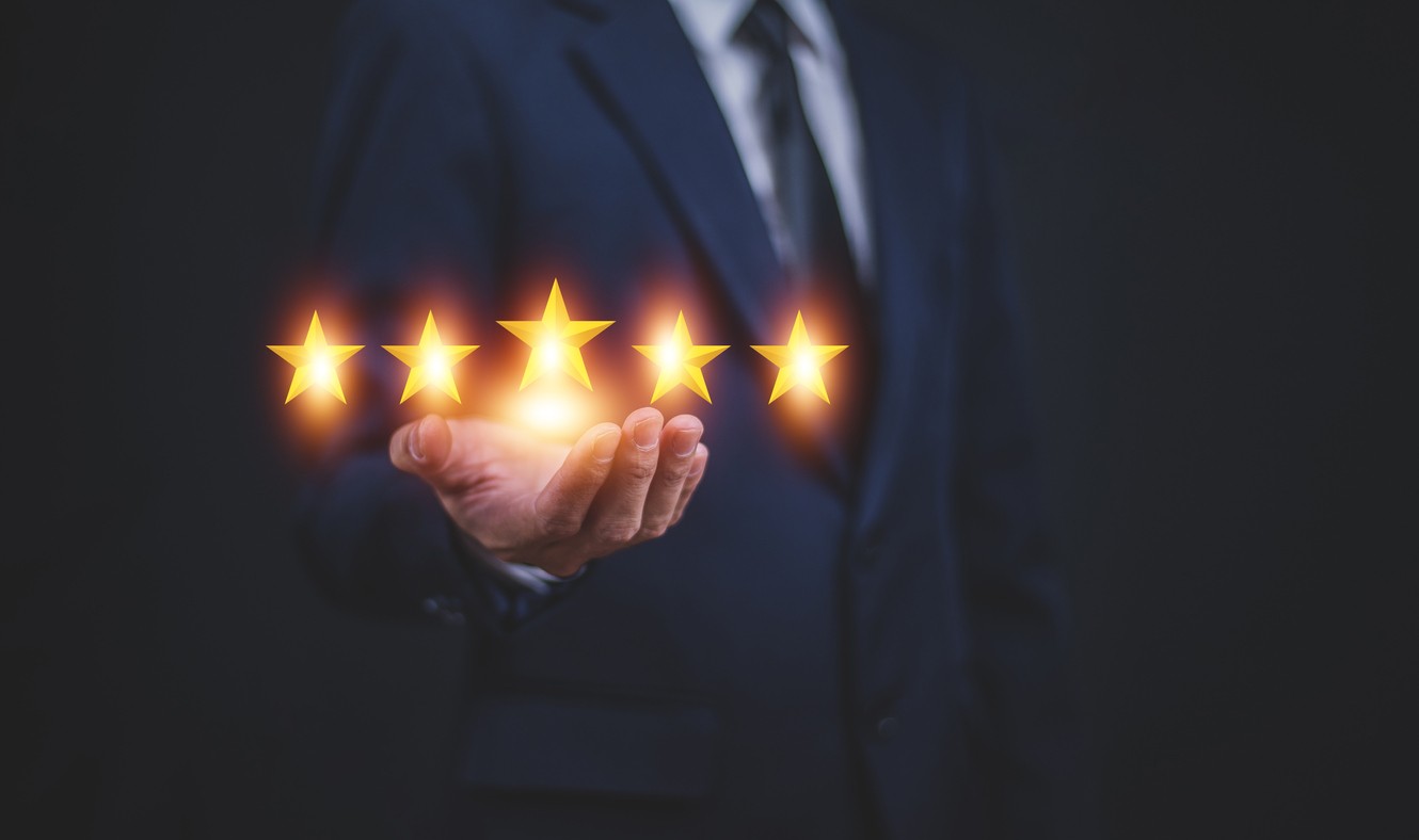 business guys showing his hands with five stars