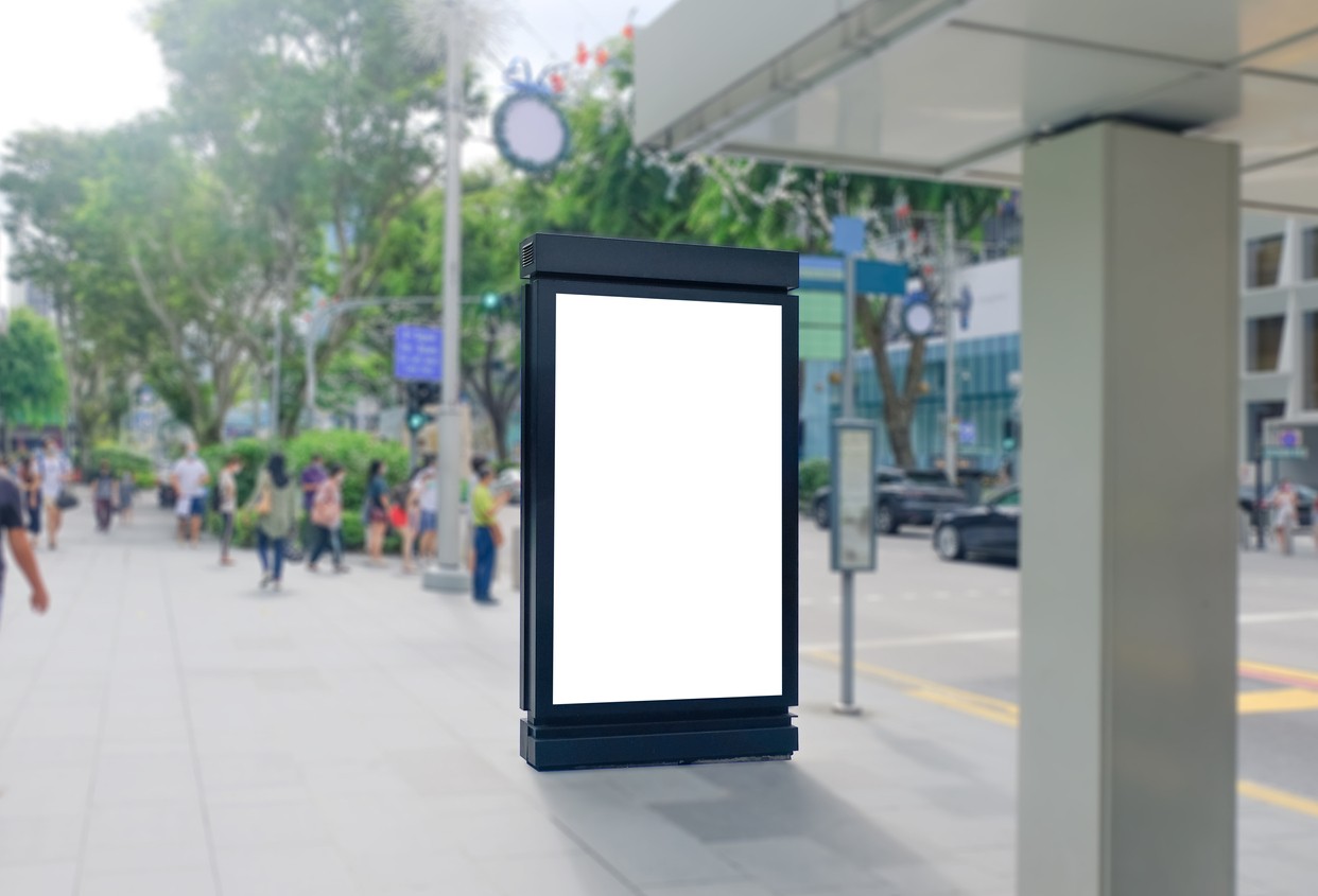 Blank vertical advertising poster banner with people walking in the background